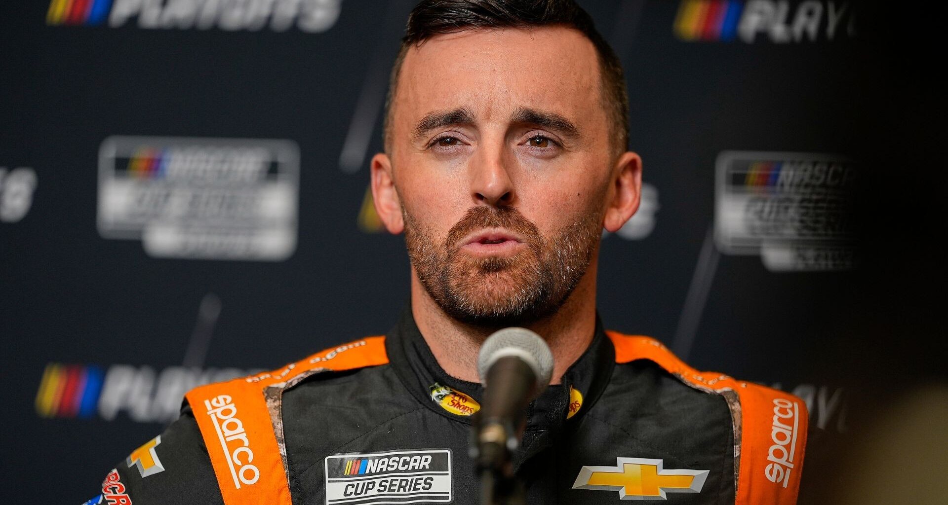 NASCAR Cup Series driver Kyle Busch (left) talks with driver Austin Dillon (right) on pit road during practice and qualifying for The Great American Getaway 400 at Pocono Raceway.