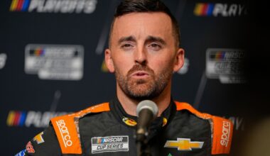 NASCAR Cup Series driver Kyle Busch (left) talks with driver Austin Dillon (right) on pit road during practice and qualifying for The Great American Getaway 400 at Pocono Raceway.