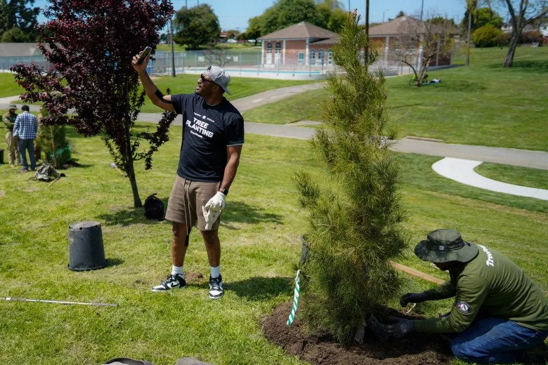 When the projects were first announced, one community group accused the city of partaking in “greenwashing.” In 2023, when the Los Angeles Clippers planted trees, the group called it “the art of bamboozle.” (Courtesy of the Los Angeles Clippers)