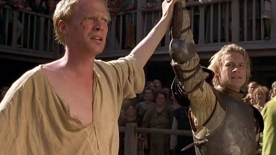  Paul Bettany and Heath Ledger hand in hand in A Knights Tale . 