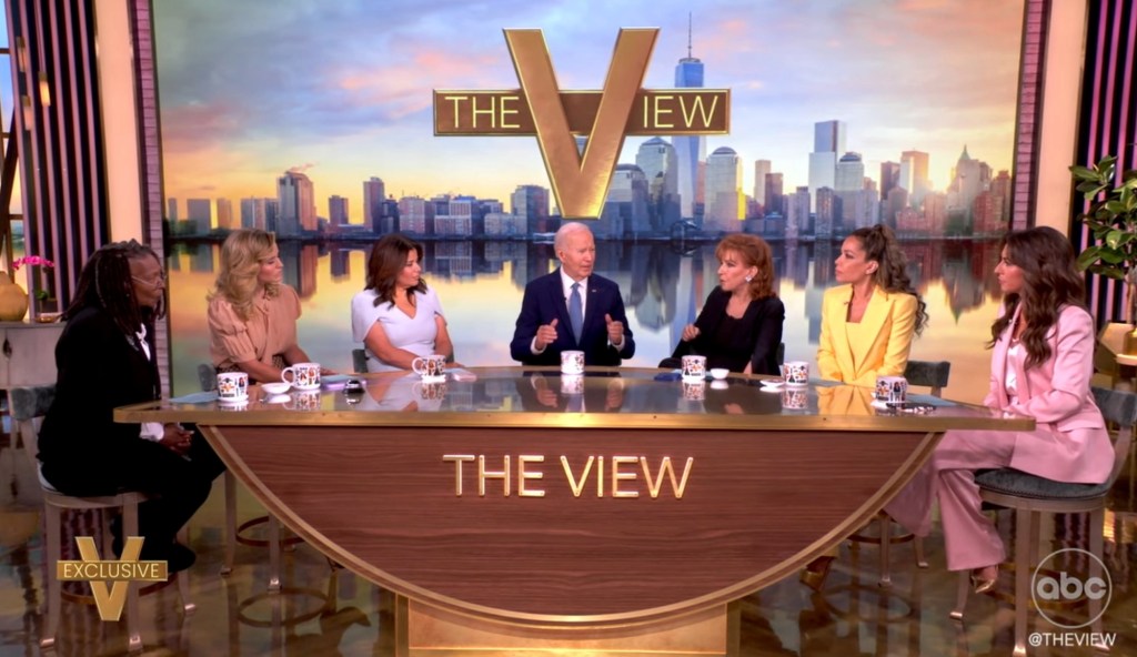 Former President Joe Biden and the hosts of The View sitting around a table.