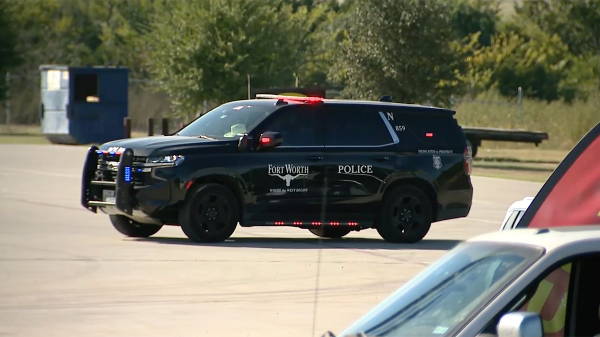 A police cruiser parked near the scene of the crash.