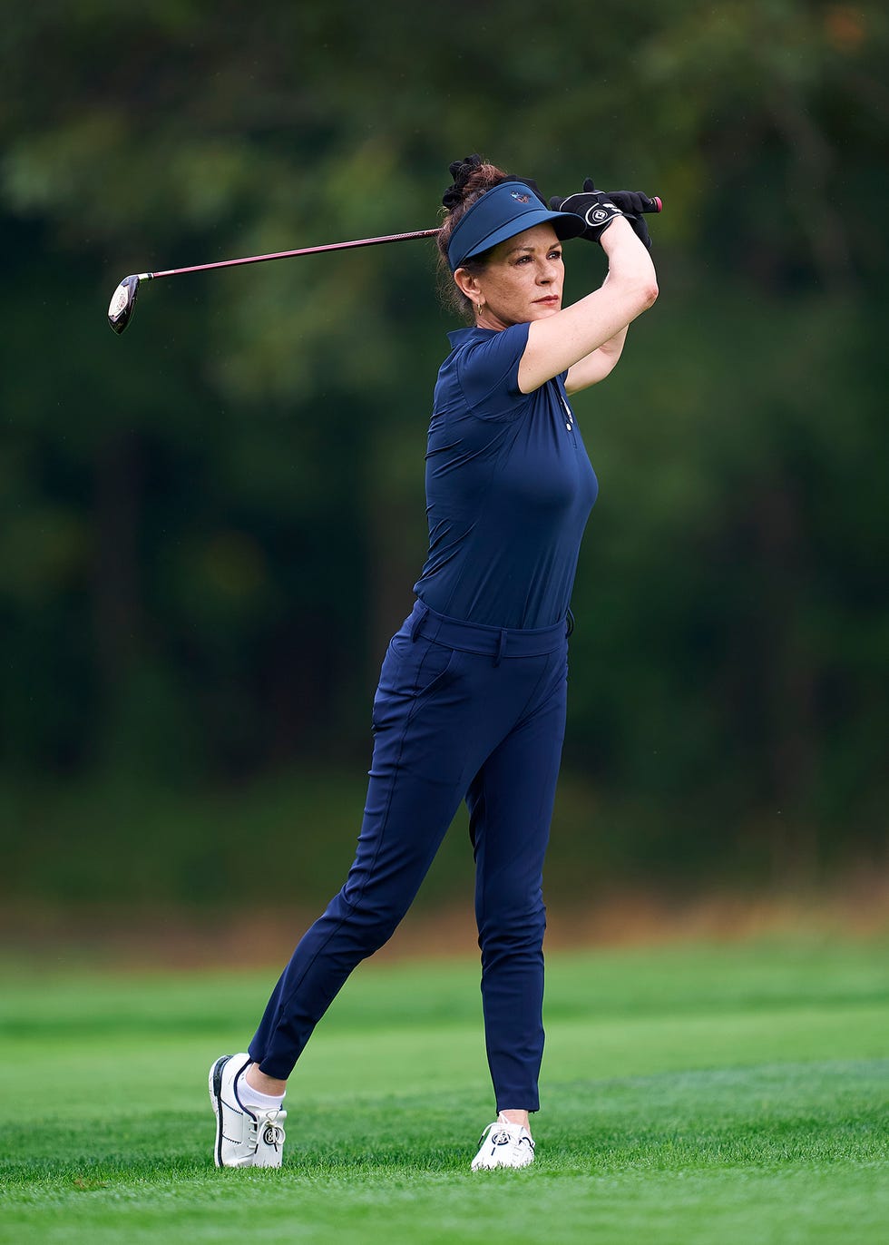 farmingdale, new york september 24: actress catherine zeta jones plays her second shot on the first hole prior to the ryder cup 2025 at black course at bethpage state park golf course on september 24, 2025 in farmingdale, new york. (photo by mateo villalba/getty images)