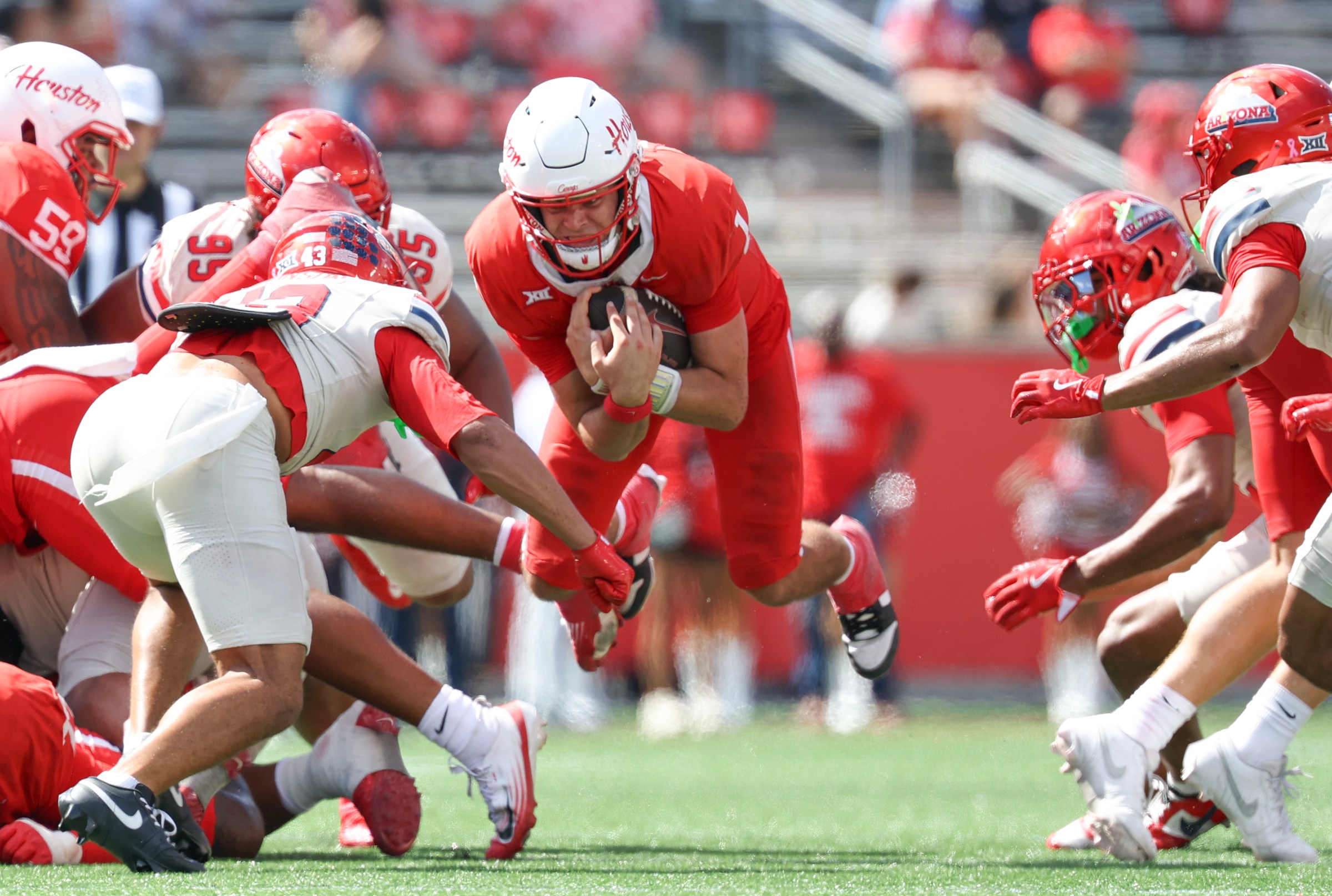 Houston QB Conner Weigman threw for three TD and added one as a runner. He produced a career-best 98 rushing yards in the win over Arizona.