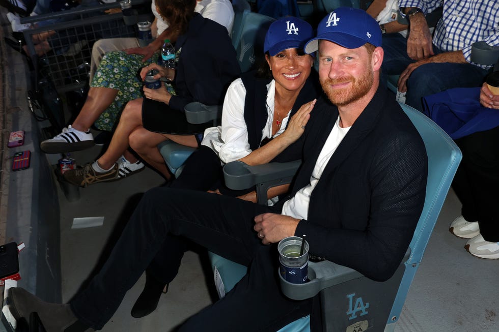 los angeles, ca october 28: prince harry, duke of sussex and meghan, duchess of sussex pose for a photo during game four of the 2025 world series presented by capital one between the toronto blue jays and the los angeles dodgers at dodger stadium on tuesday, october 28, 2025 in los angeles, california. (photo by joe scarnici/mlb photos via getty images)