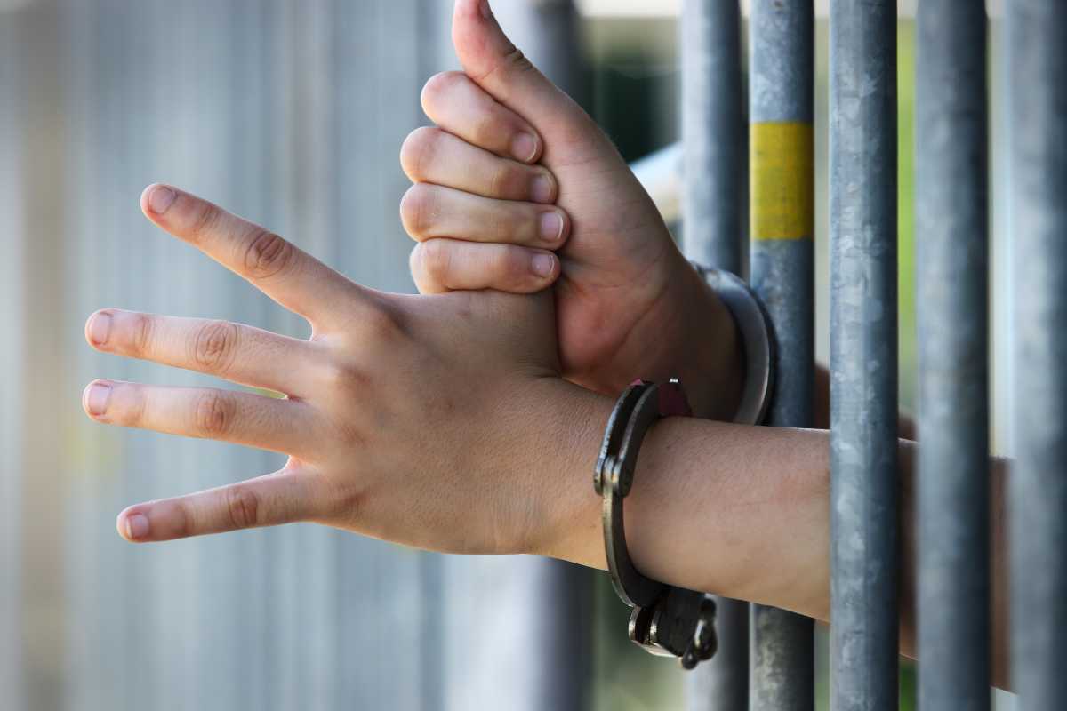 Editorial | The push for NYC jail reform should address a complex truth 1 hands in handcuffs in jail at juvenile detention center