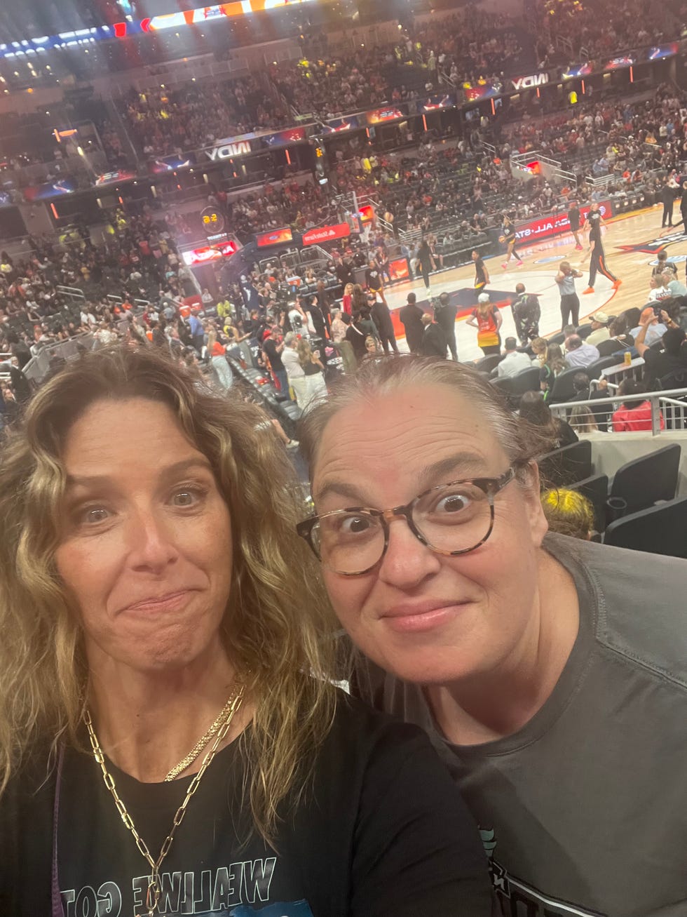 two women at a wnba game