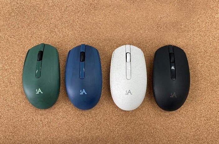 Four Accuratus Bio M100 Multidevice Wireless Mice on a cork board