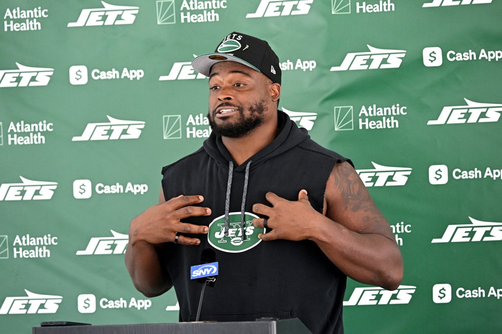 Jets guard John Simpson speaks to the media before practice at training camp in Florham Park, N.J. 