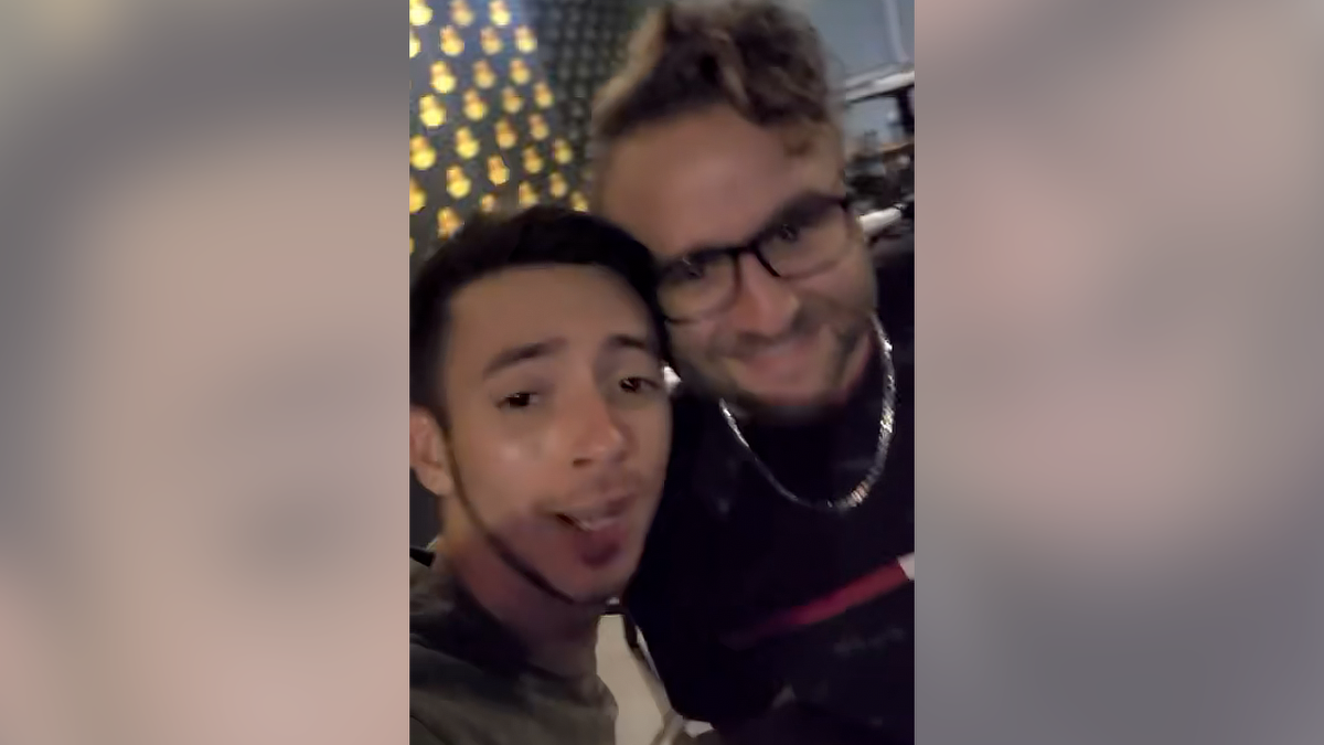 Kenneth Cutting Jr seen on the left of a still image taken from a selfie video inside a Houston bar