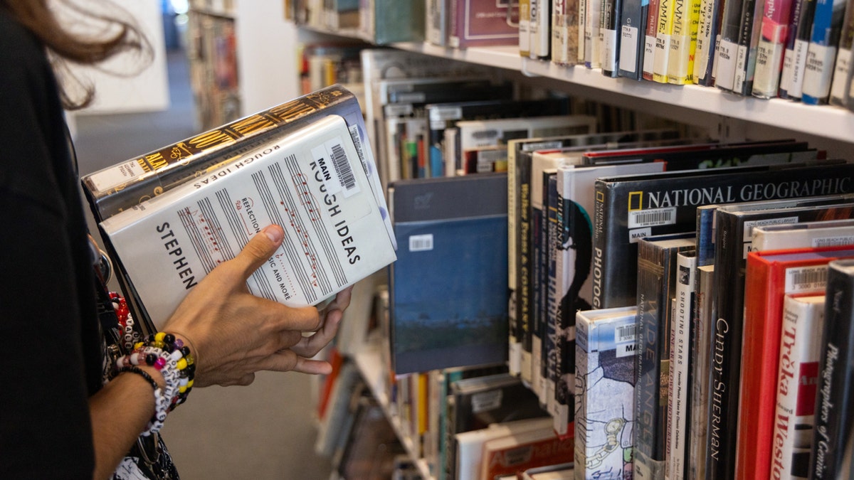 Library page shelving books