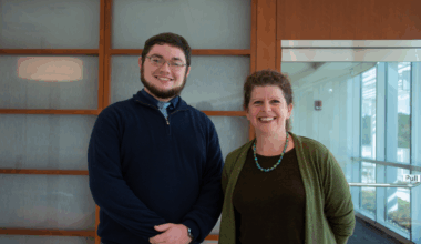 Conner Linehan and Jennifer Stroop stand in front of the Cancer Center