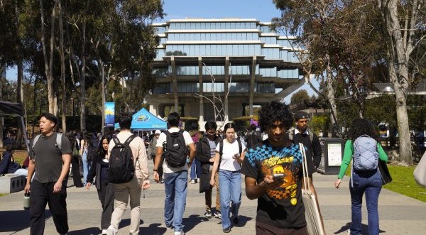 Students pass UC San Diego's Geisel Library on the La Jolla campus in February. (Nelvin C. Cepeda / The San Diego Union-Tribune)