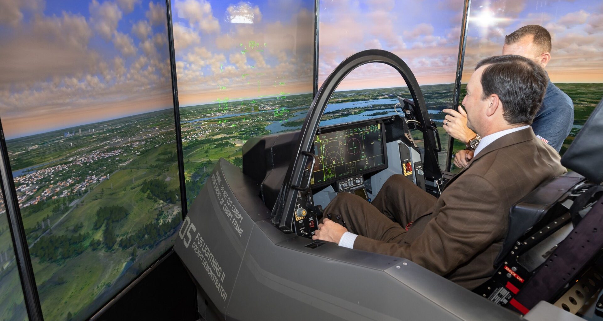 U.S. Rep. Craig Goldman takes flight in F-35 simulator during visit to the Aviation and Defense Capital of Texas
