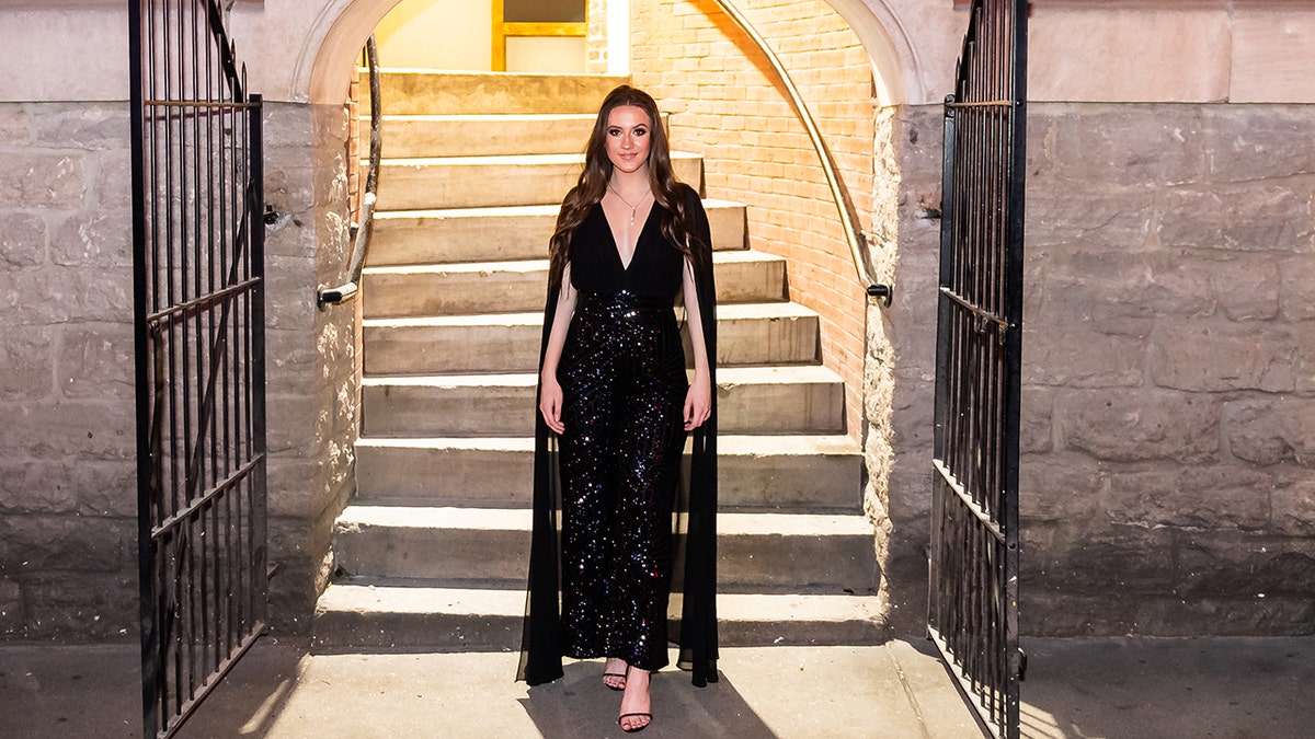 Maggie Baugh standing, smiling