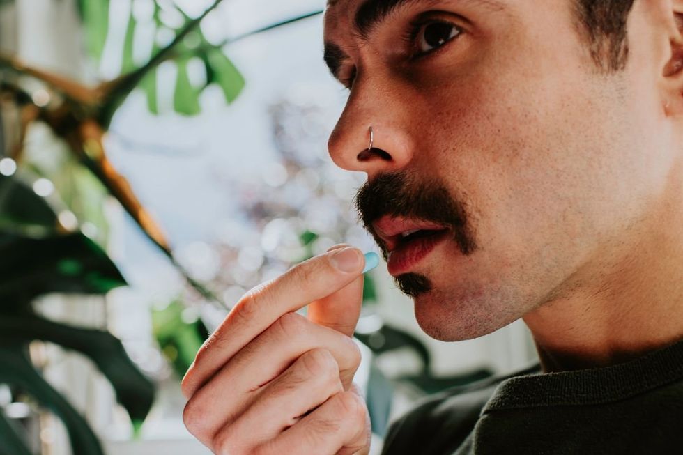 Man taking painkillers