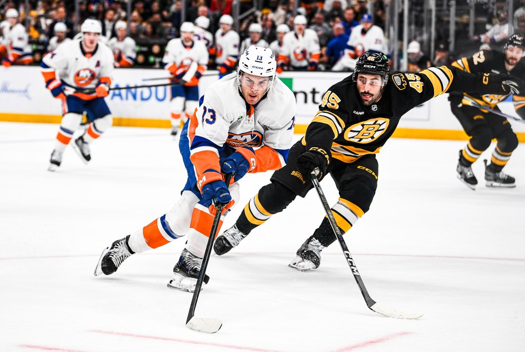 Mathew Barzal #13 of the New York Islanders skates with the puck against Jonathan Aspirot #45 of the Boston Bruins during the second period on Oct. 28, 2025.