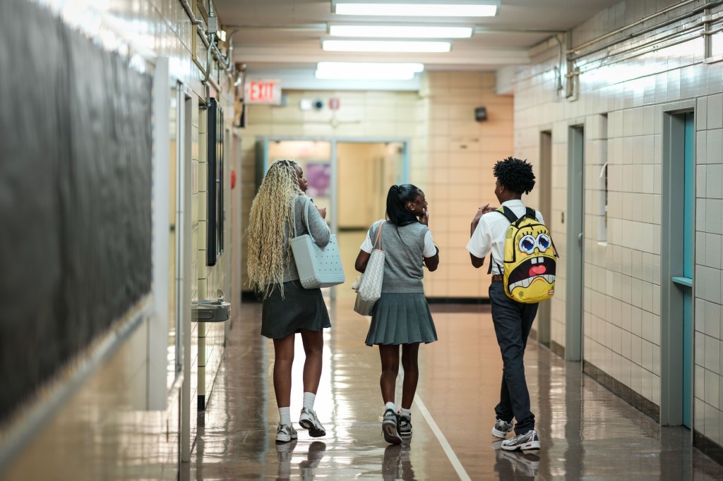 Kids walking down school hall