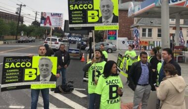 Assemblyman Pedro Mejia campaigns on a corner in North Bergen for Mayor Nick Sacco.