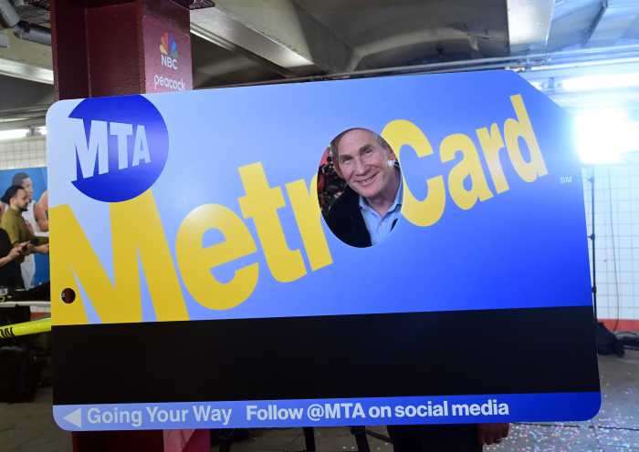 Fantastic fare-well: How the MTA and famous NYC food vendors are giving the MetroCard a delicious departure 4 a large MetroCard prop that is yellow and blue