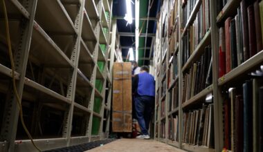 Workers clean books at Cleveland Public Library's Lakeshore Facility