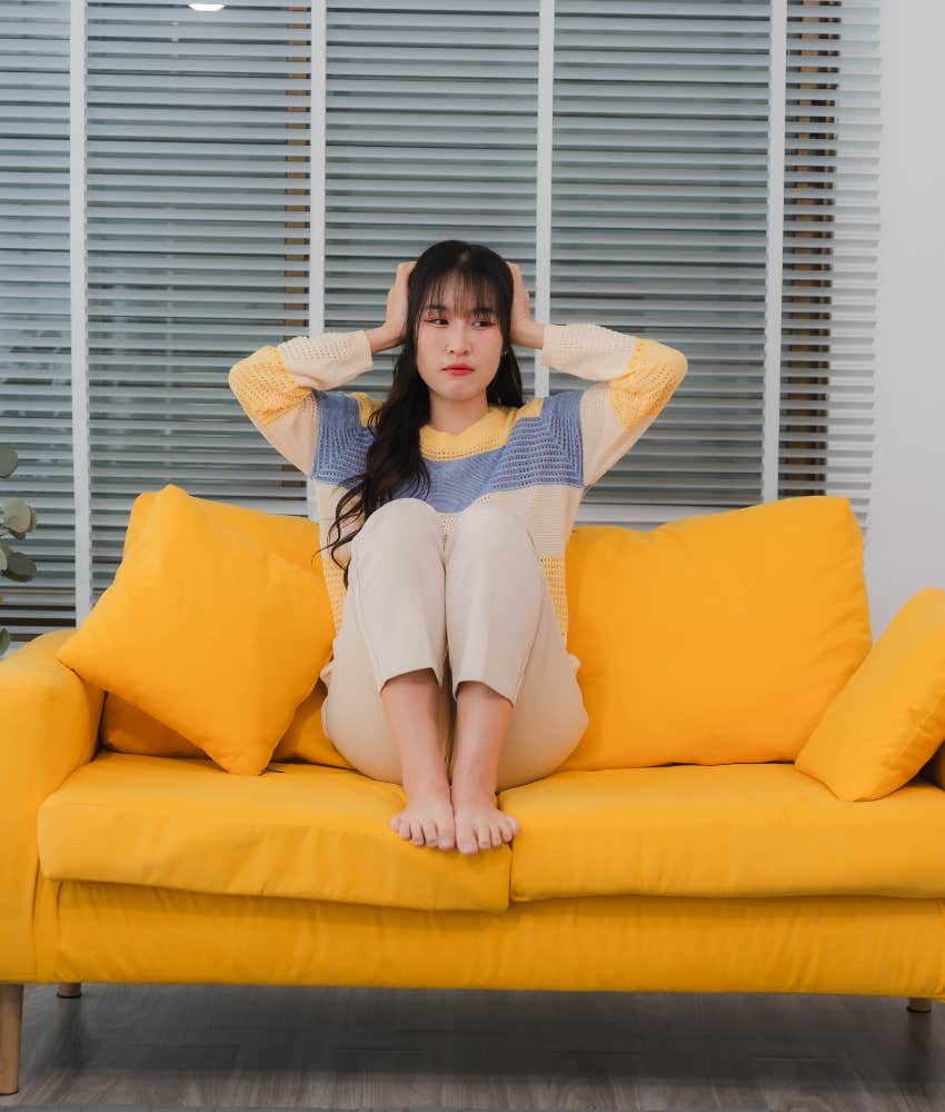 Woman Questions If The Burnout That Everyone Is Feeling Right Now Is Going To Last Forever Woman tuning out the news in an effort to combat feelings of burnout