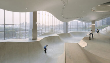 curved urban skatepark in floating glass volume overlooks shanghai’s skyline