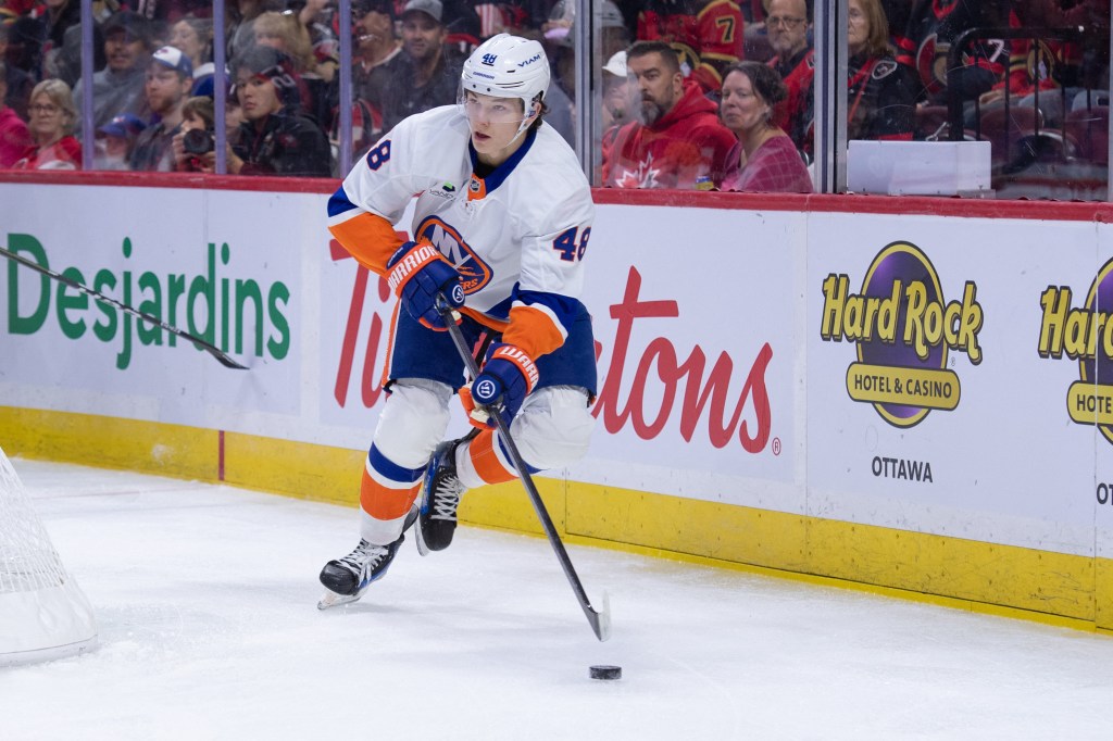 Islanders defenseman Matthew Schaefer (48) skates with the puck against the Senators on Oct. 18, 2025.