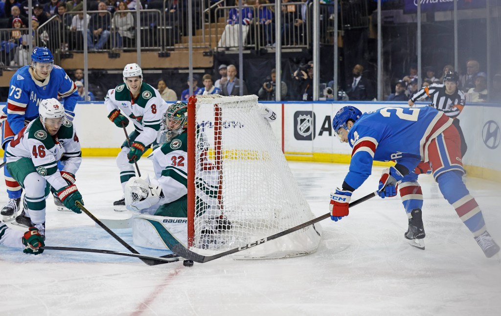 Carson Soucy tries to score a goal and is stopped by Minnesota Wild defenseman Jared Spurgeon in the third period.