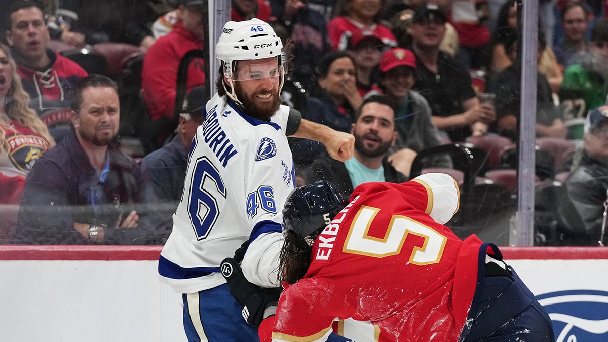 Aaron Ekblad tries to avoid a punch
