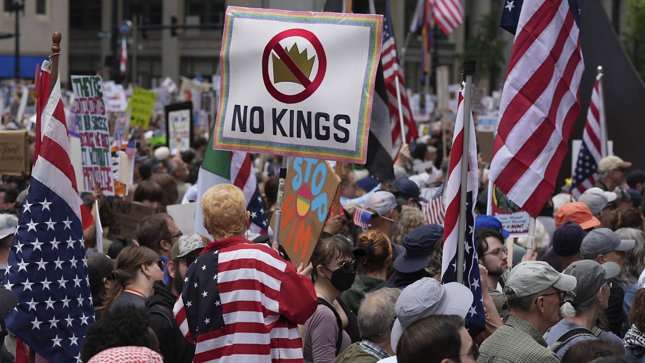 Demonstrators take part in the "No Kings Day" protest, Saturday, June 14, 2025, in Chicago. (AP Photo/Nam Y. Huh)