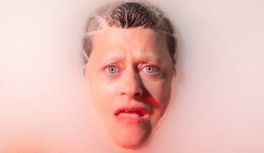 A woman face up in bathwater.