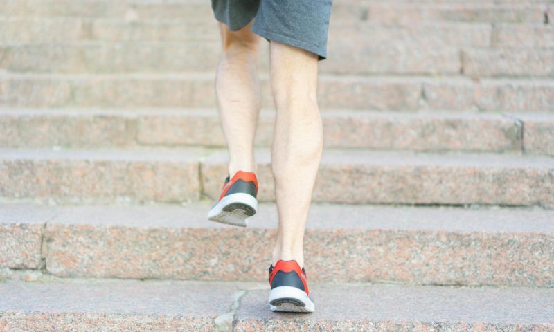 Man walking up stairs steps