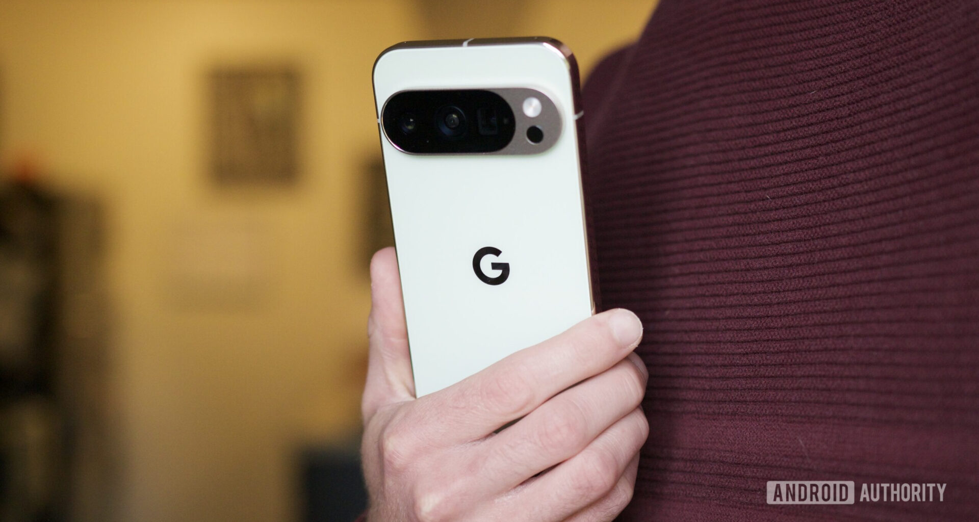 Someone holding the Pixel 10 Pro, showing the back of the phone.