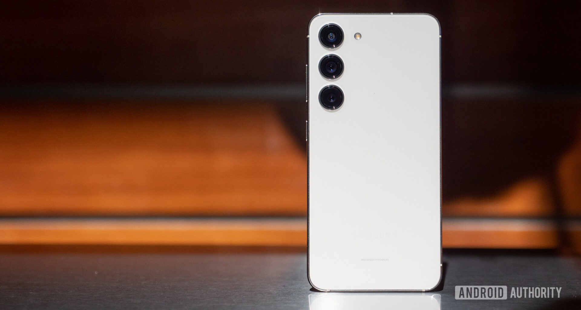 A Samsung Galaxy S23 standing on end.