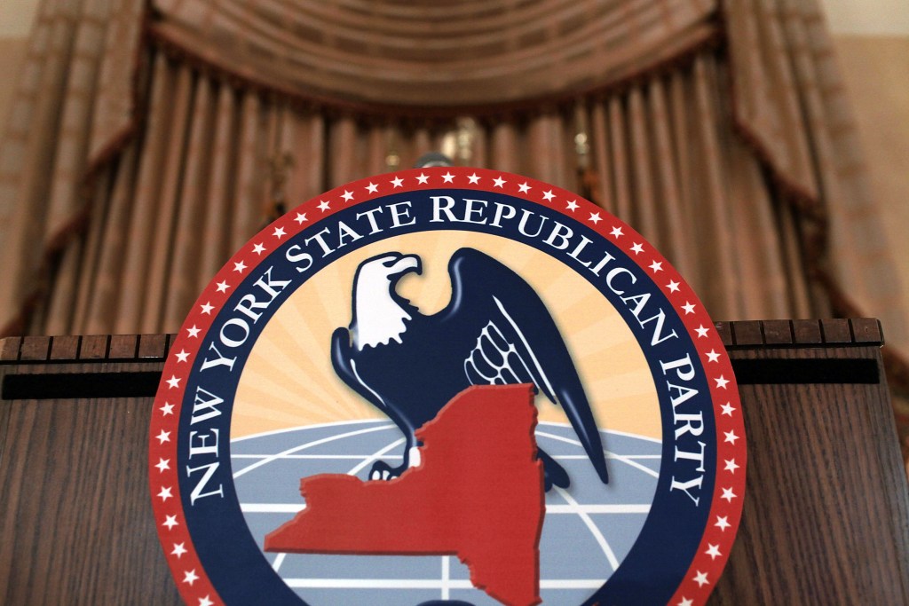 Seal of the New York State Republican Party on a podium.