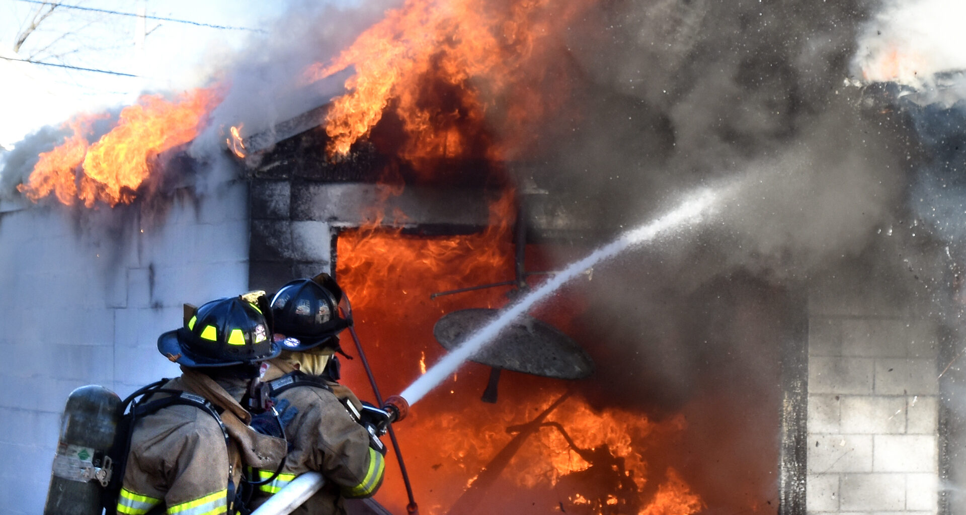 Firefighters Extinguish Highland Park Garage Blaze