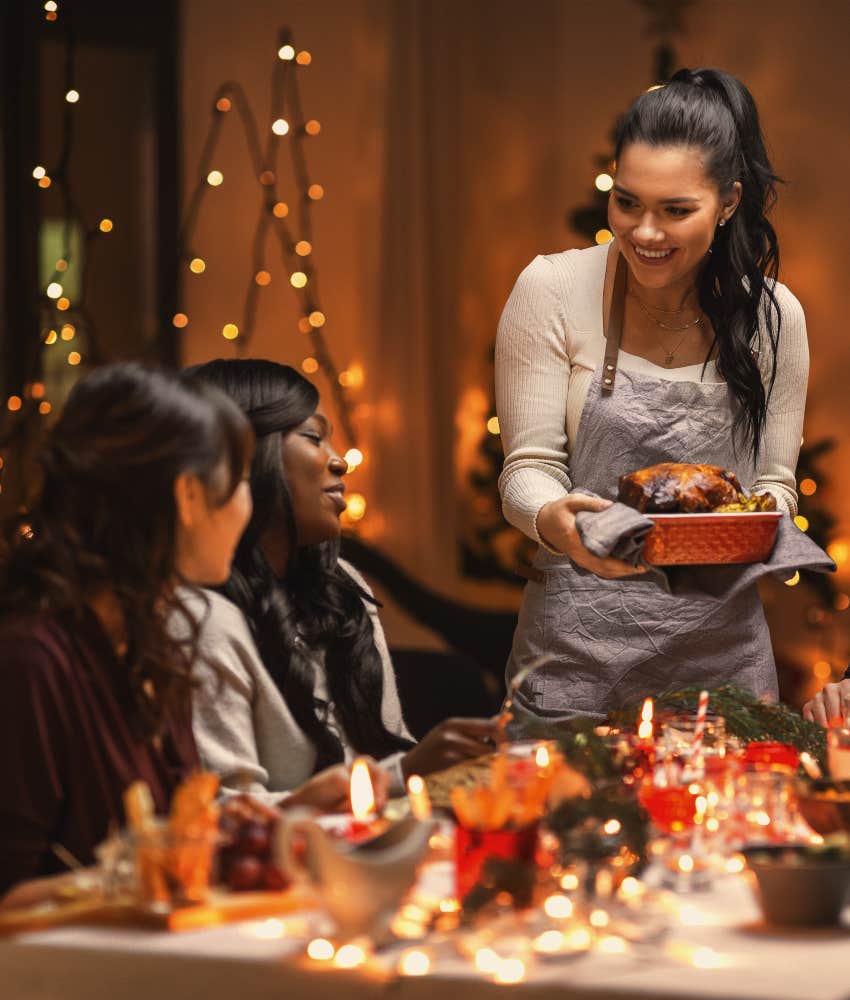 People Are Making These Sacrifices to Save Money This Holiday Season woman serving holiday meal