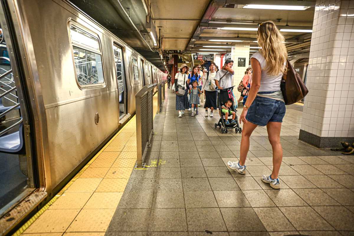 Op-Ed | MTA Chair: Subway ridership surge is evidence of New York’s comeback 1 Commuters walk past the platform barriers at the 8th Avenue subway station in Manhattan.