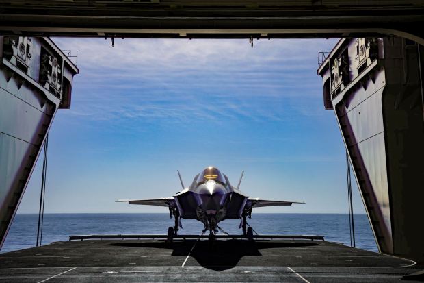 A U.S. Marine F-35B is lowered by the ships elevator into the hangar bay of Japan's JS Kaga on Wednesday, Nov. 6, 2024. The Kaga is operating off the coast of San Diego.  (Nelvin C. Cepeda / The San Diego Union-Tribune)