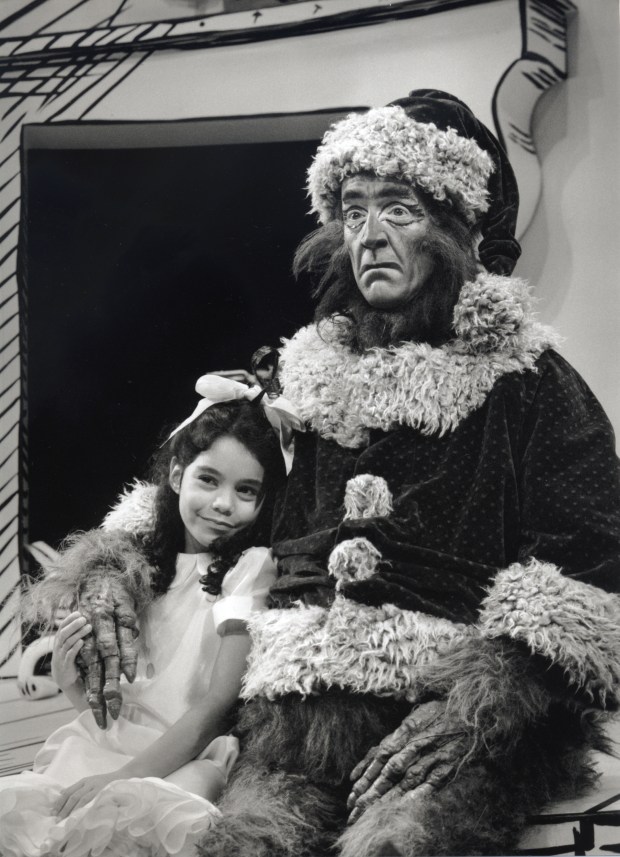 Vanessa A. Hudgens as Cindy-Lou Who and Guy Paul as the Grinch in The Old Globe's inaugural 1998 production of "Dr. Seuss's How the Grinch Stole Christmas!" The "Grinch" musical is now in its 27th year. (Ken Howard)