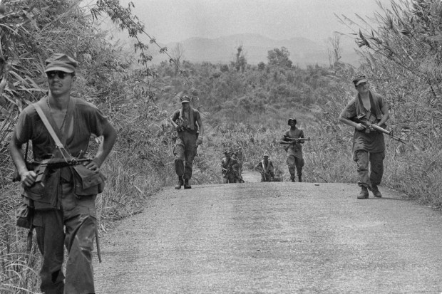 Marines of "Delta" Company, 1st Battalion, Fifth Marine Regiment, 1st Marine Division, sweep Route 545 and the mountain area near Nui Bong southeast of Phu Bai in Vietnam during a combat sweep on May 2, 1968. (Cpl. D. I. Fisher / National Archives)