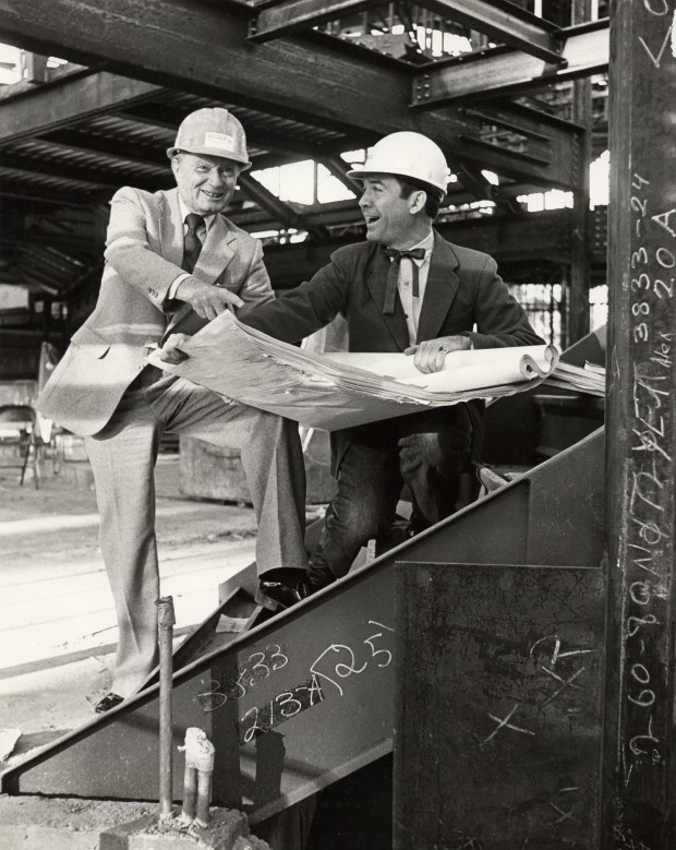 Old Globe artistic director Craig Noel, left, and future artistic director Jack O'Brien during the rebuilding of The Old Globe following an arson fire in March 1978. (The Old Globe)