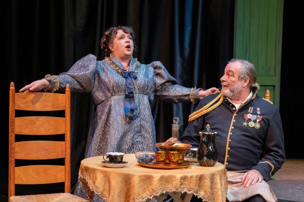 Melissa Fernandes and Manny Fernandes as the Petkoffs in Lamb's Players Theatre's "Arms and the Man. (J.T. MacMillan)