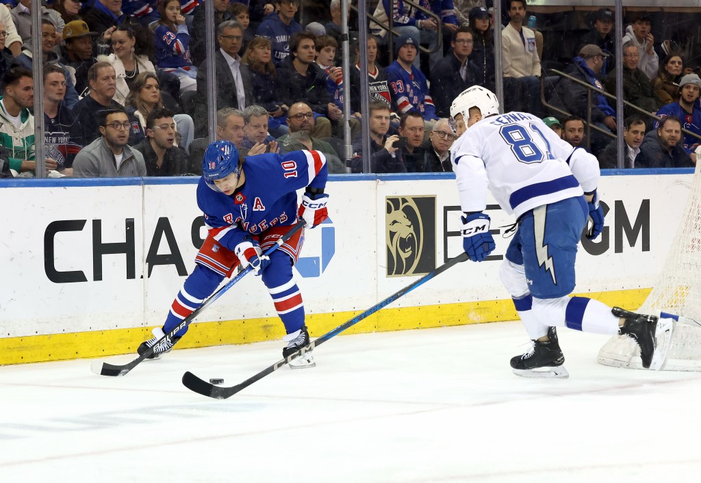 New York Rangers left wing Artemi Panarin #10 moves the puck as Tampa Bay Lightning defenseman Erik Cernak #81 rushes to defend.