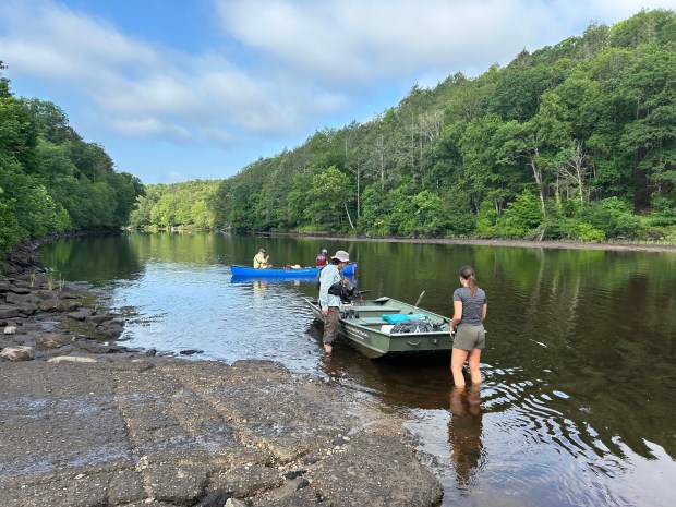 Staffers from DEEP and state Office of Aquatic Invasive Species prepare to look for endangered native plants along the Salmon River at Haddam Neck before approving an herbicide application to slow hydrilla growth.(Edmund H. Mahony)