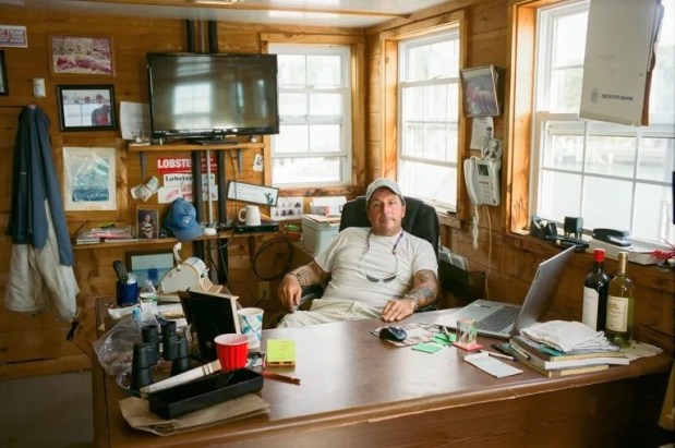 Former lobsterman Bart Mansi sits in his office on the second story of the Guilford Lobster Pound on Sept. 3, 2025. (Dana Edwards / CT Mirror)