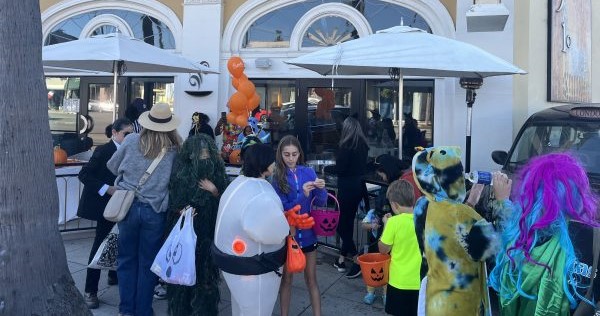 Trick-or-treaters get ready for the La Jolla Village Merchants Association’s...