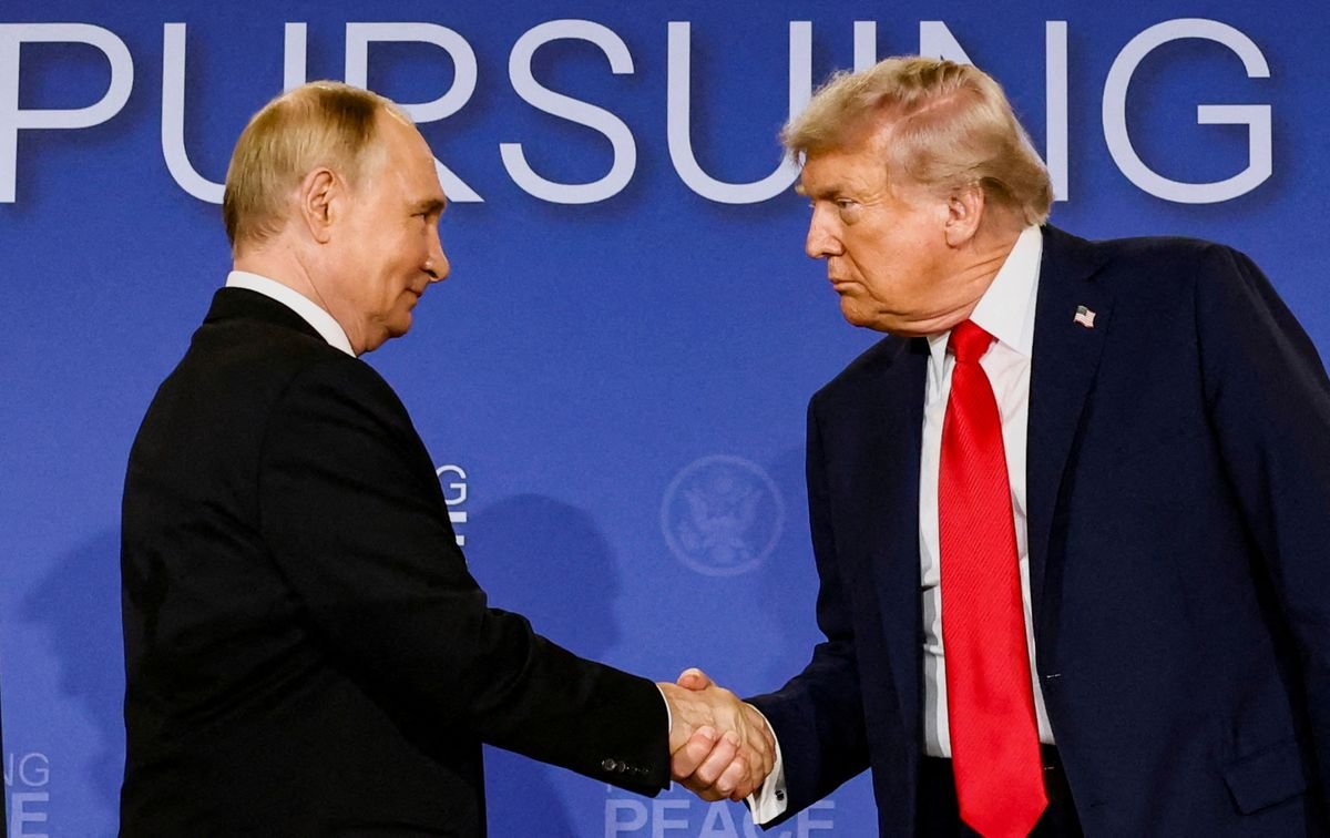 U.S. President Donald Trump and Russian President Vladimir Putin shake hands during a press conference following their meeting to negotiate an end to the war in Ukraine, at Joint Base Elmendorf-Richardson, in Anchorage, Alaska, U.S.,
