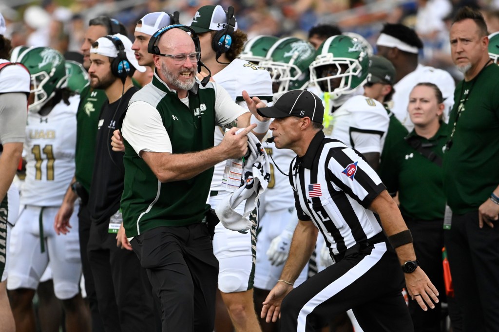 UAB Blazers head coach Trent Dilfer calls a timeout.